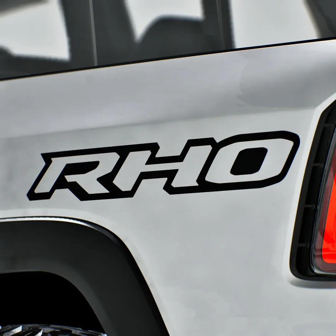 black Ram RHO blackout bedside decals on a white truck